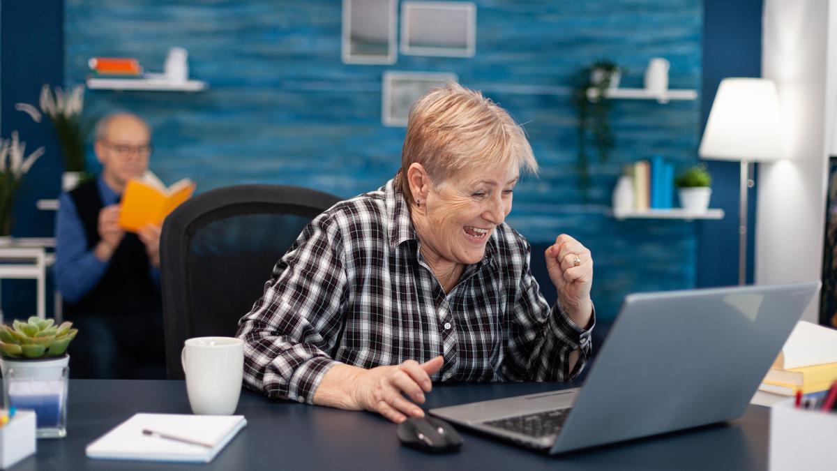 excited-mature-woman-celebrating-online-purchase_82666800