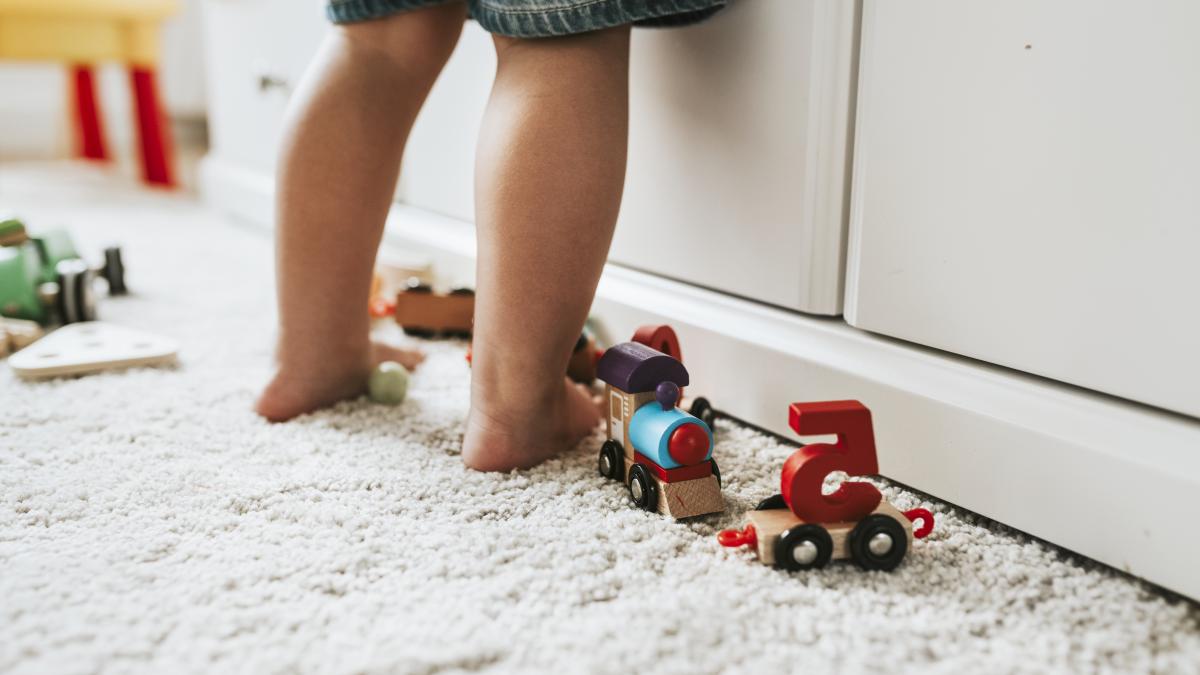 young-kid-standing-playroom_15810400