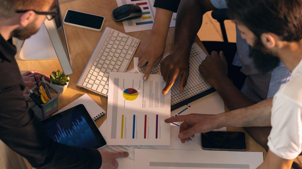 colleagues-working-together-modern-office-using-devices-gadgets-creative-meeting_05075100