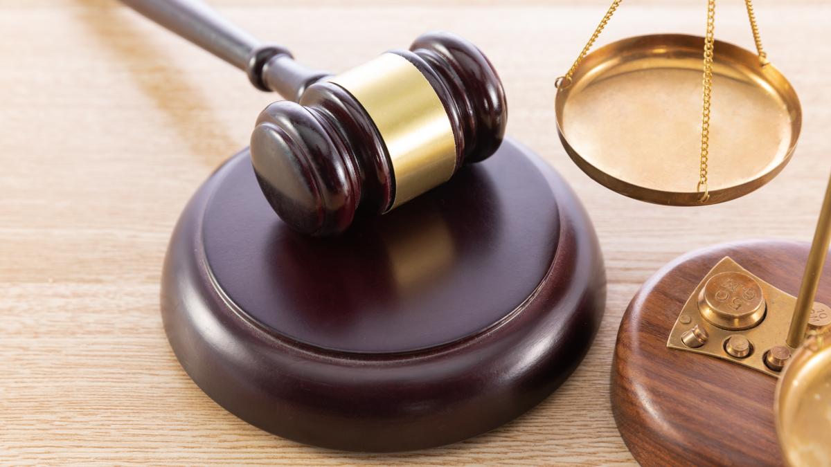 high-angle-shot-gavel-scale-wooden-surface_86869700