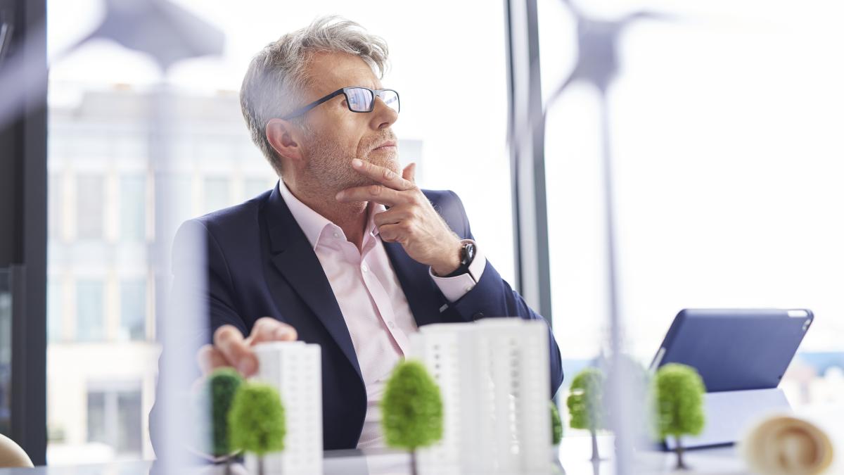 busy-businessman-thinking-about-new-solutions_54564200