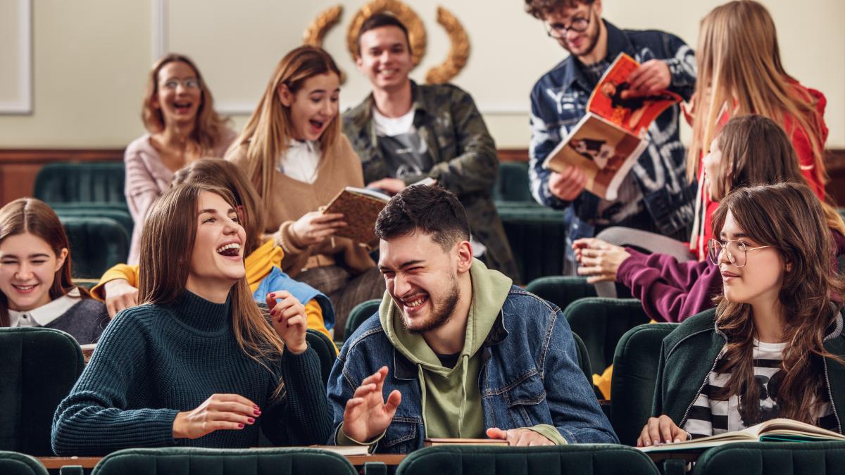 group-cheerful-happy-students-sitting-lecture-hall-before-lesson_37065600