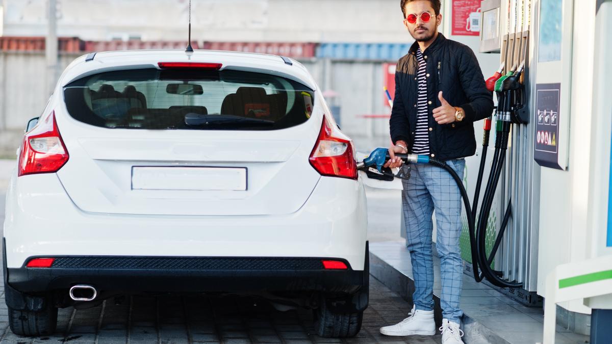 south-asian-man-indian-male-refueling-his-white-car-gas-station_87672000