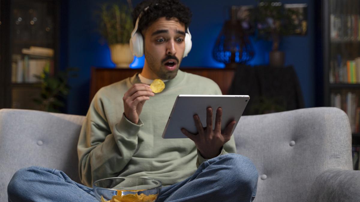 young-man-enjoying-movie-night_86457400