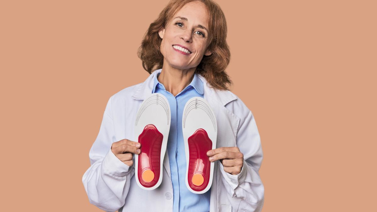 middleaged-podiatrist-with-insoles-dedicated-foot-health-care_95225600