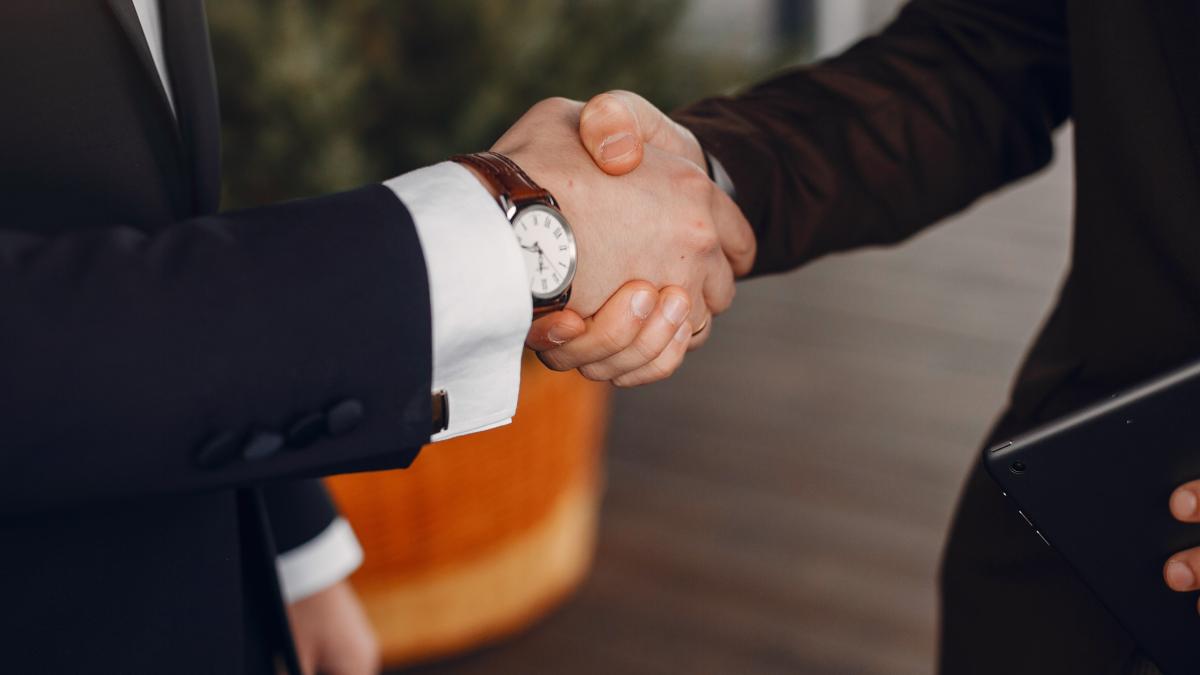 two-businessmen-working-with-tablet_65865200