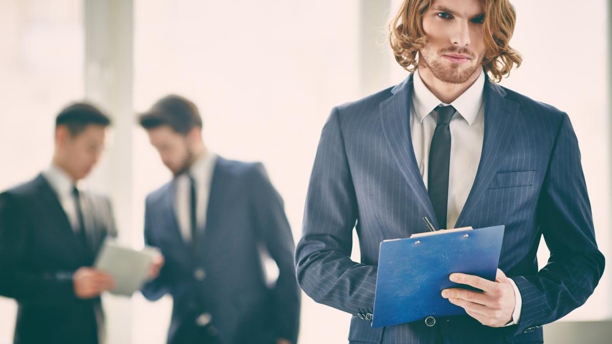 businessman-concentrated-his-work_61435800