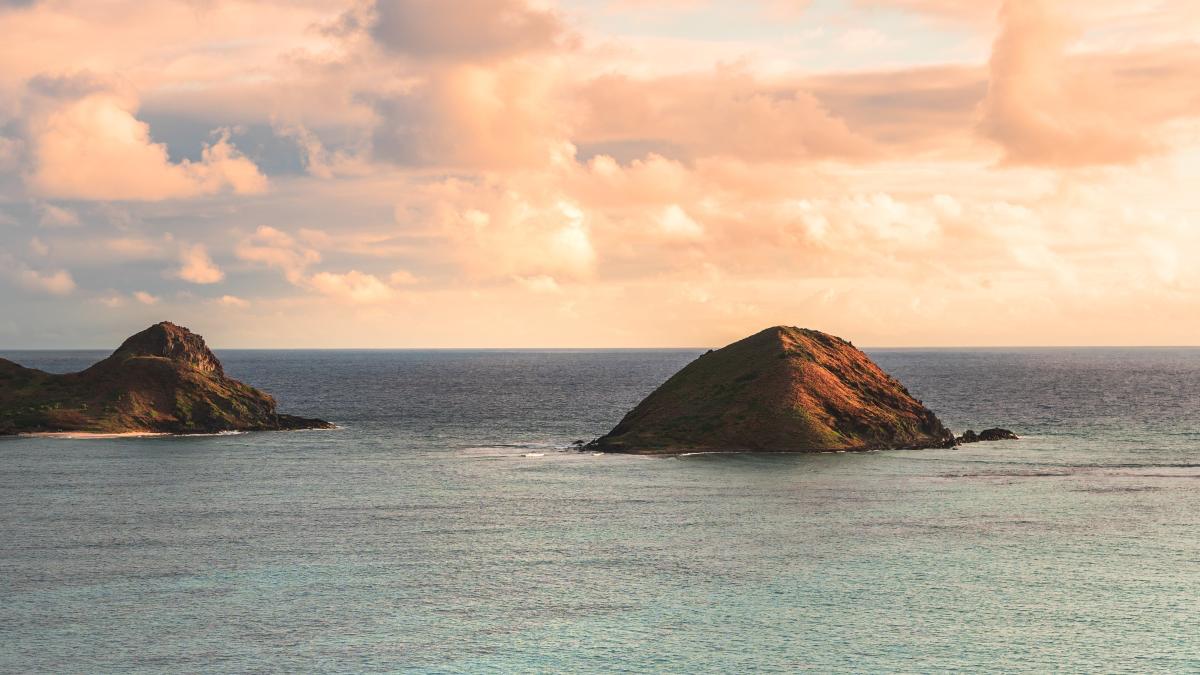 beautiful-shot-small-hills-sea-beautiful-cloudy-sky_97996400