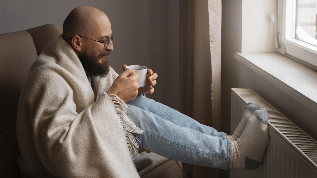 man-drinking-hot-beverage-during-energy-crisis_49067100