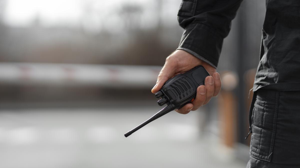 portrait-male-security-guard-with-radio-station_34786700