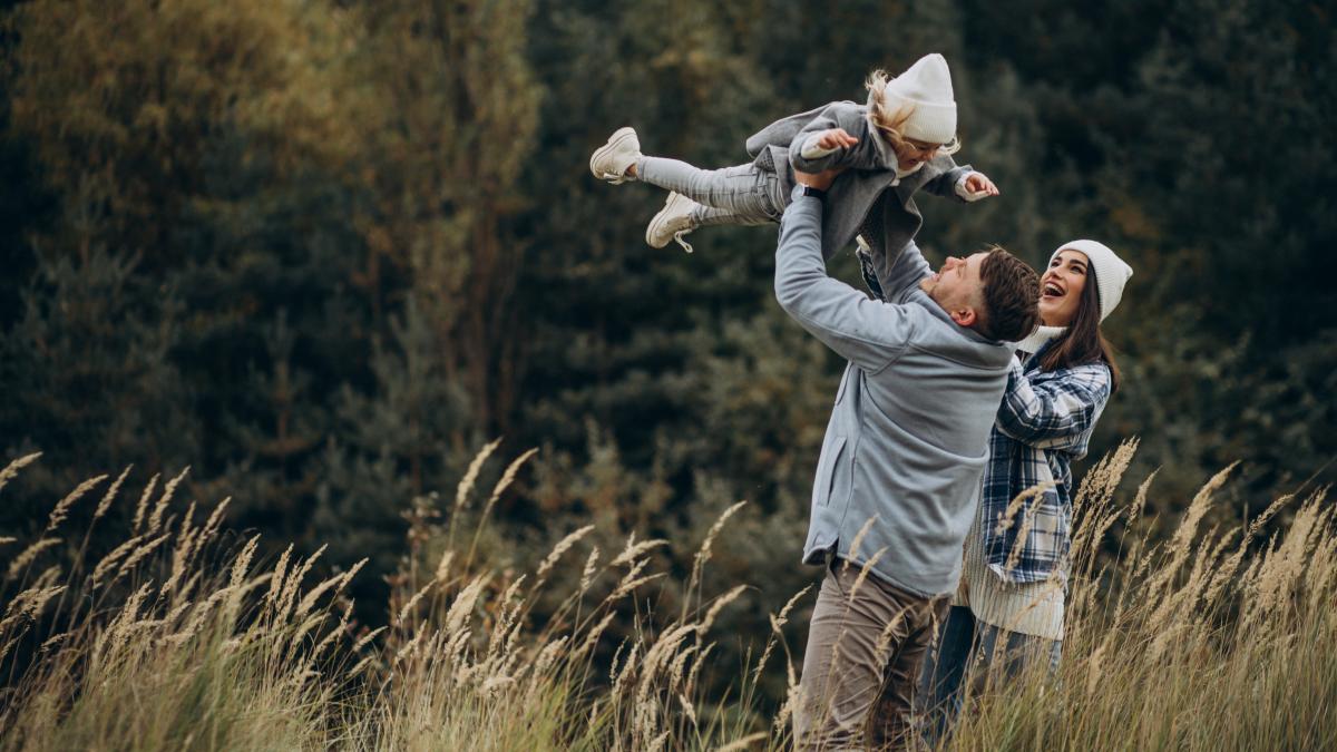 family-with-little-daughter-together-autumnal-weather-having-fun_63961200