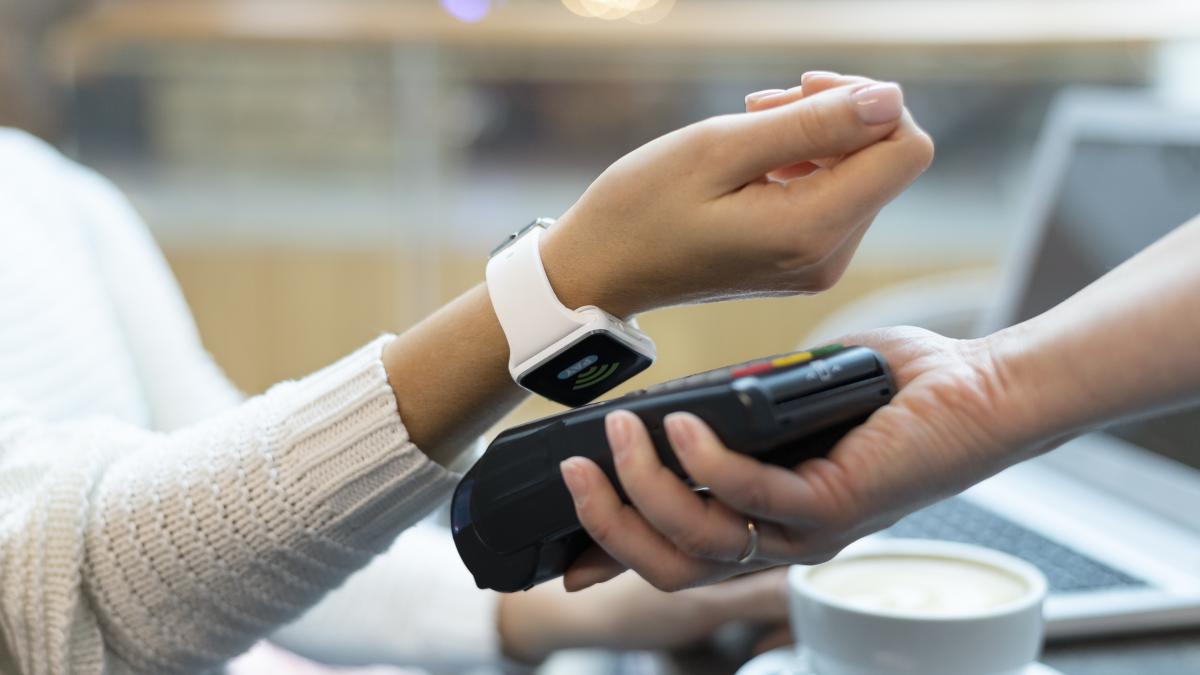 person-paying-with-its-smartwatch-wallet-app_52738200