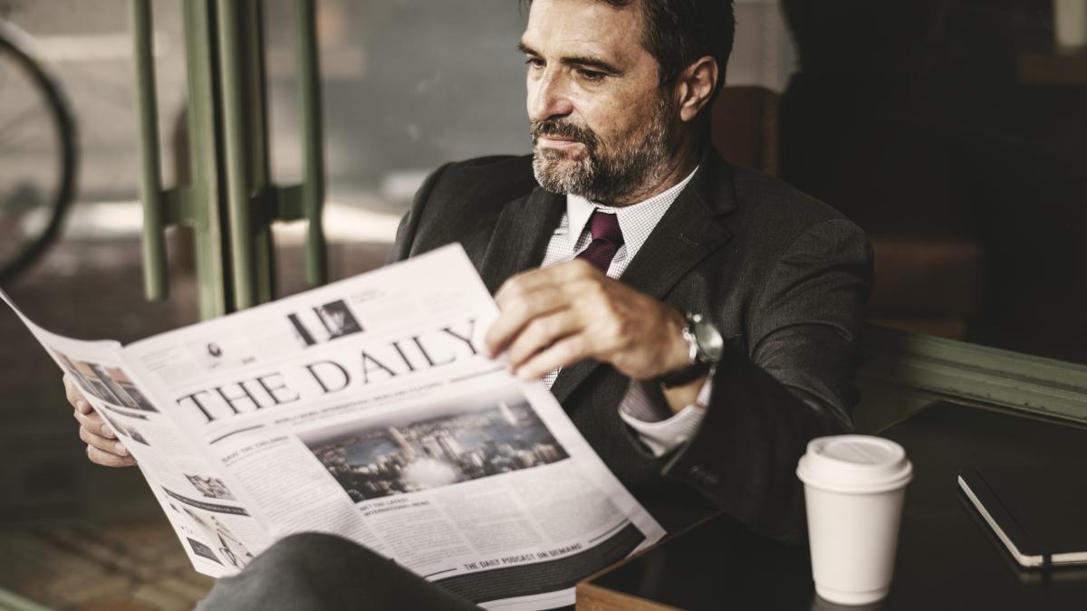 businessman-reading-daily-news_50251500