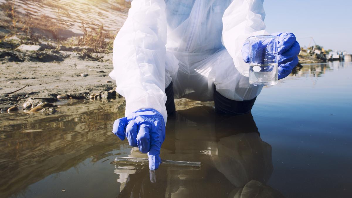 ecologist-taking-samples-water-with-test-tube-from-city-river-determine-level-contamination-pollution_21503900