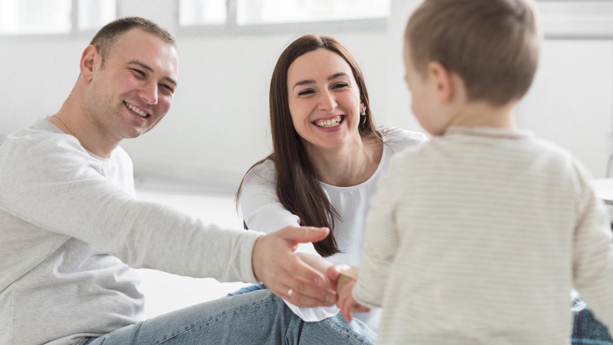 parents-playing-with-child_67588700