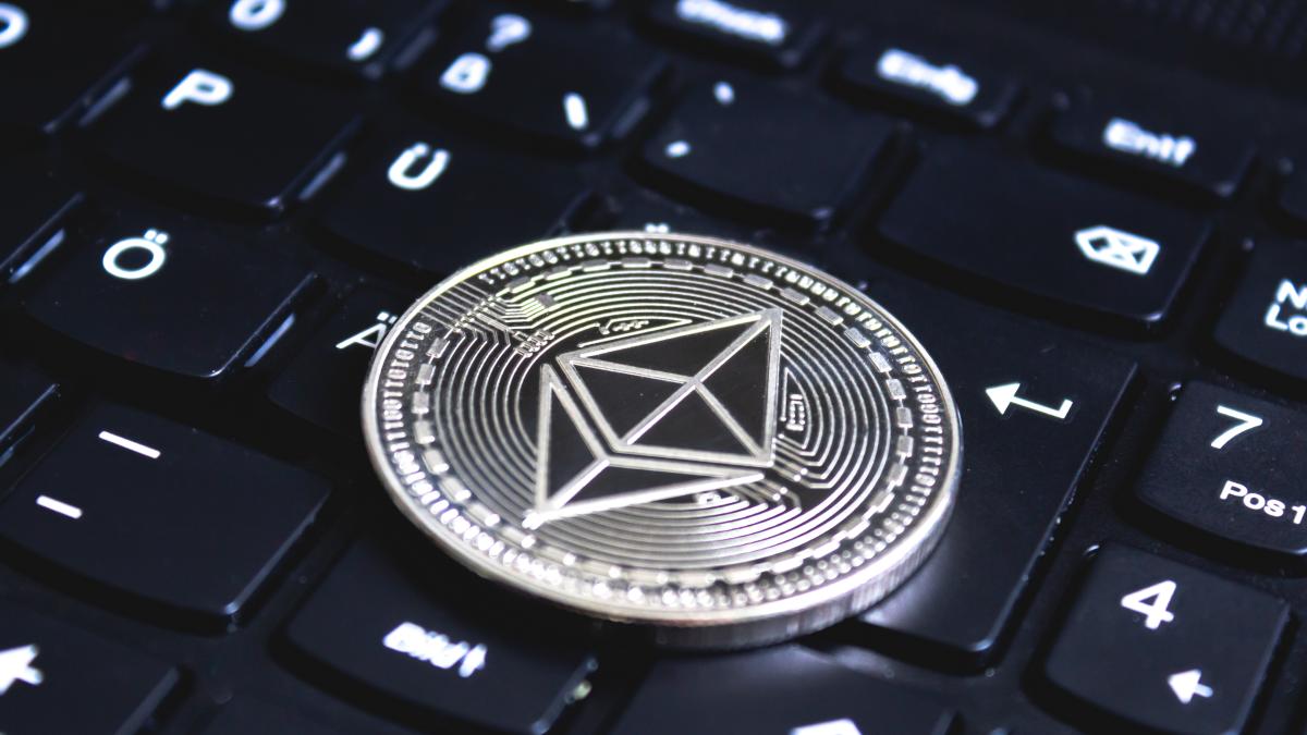 large-coin-placed-top-black-computer-keyboard_57280100