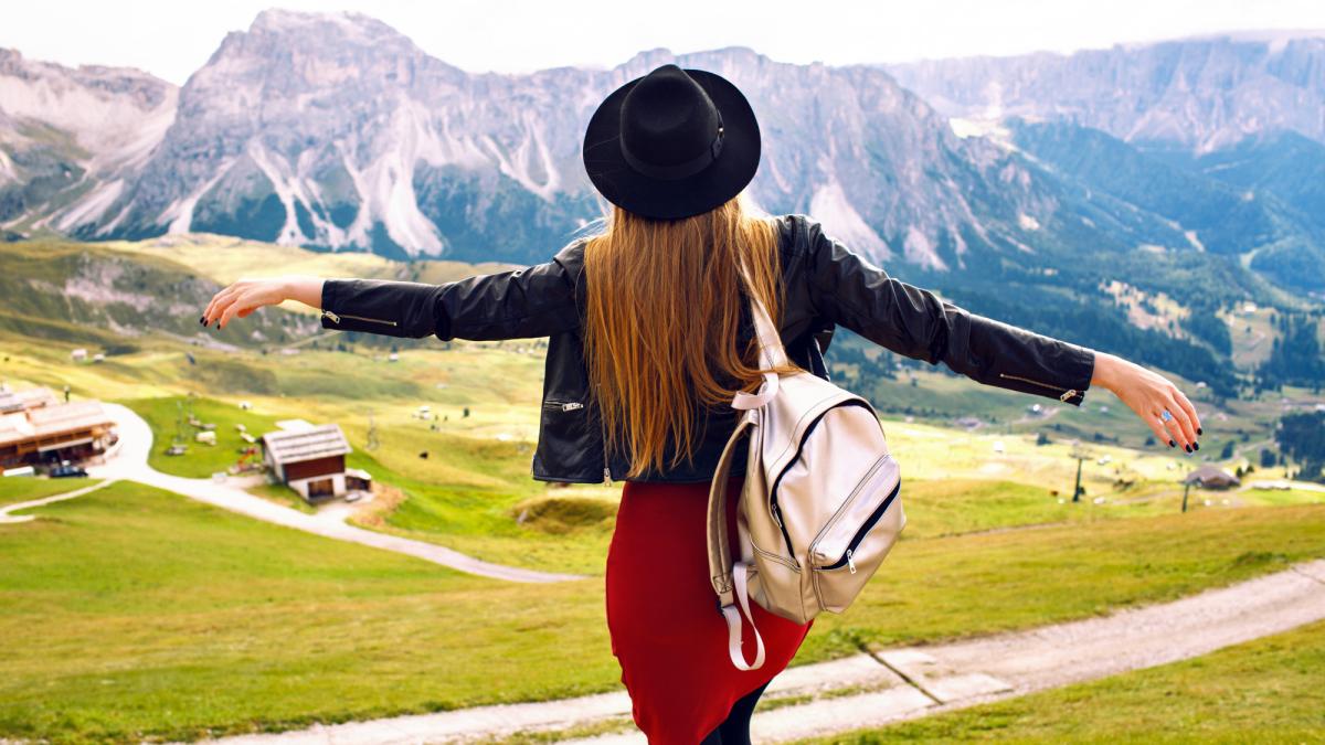 amazing-traveling-experience-image-beautiful-stylish-woman-posing-back-looking-breathtaking-mountains-view-trip-italian-dolomites-hipster-girl-enjoying-adventures_98529800