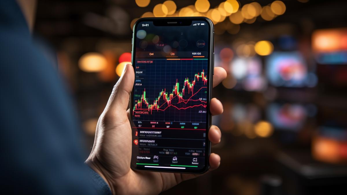 binance-mobile-app-with-evolution-crypto-currency-coin-smartphone-front-laptop-following-stock-market-movement-blue-background-romania-2022-high-quality-photo_16096400