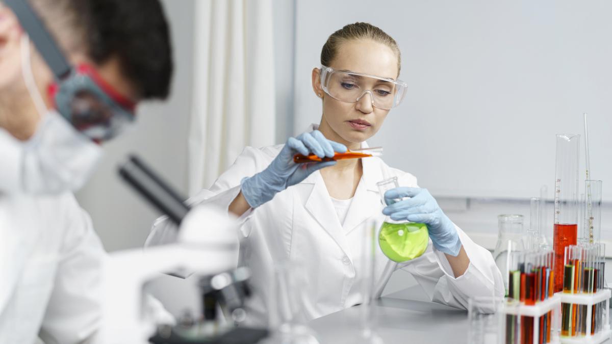 female-researcher-laboratory-with-test-tubes-male-colleague_40213600
