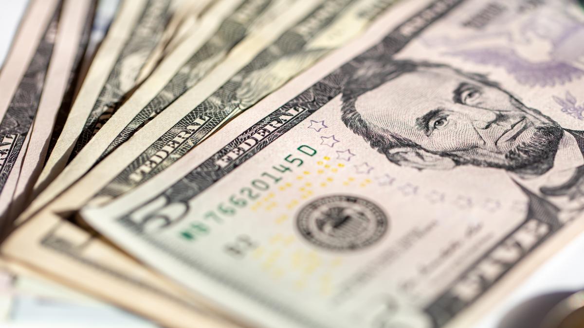 five-dollar-bills-close-up-soft-focus_22414600