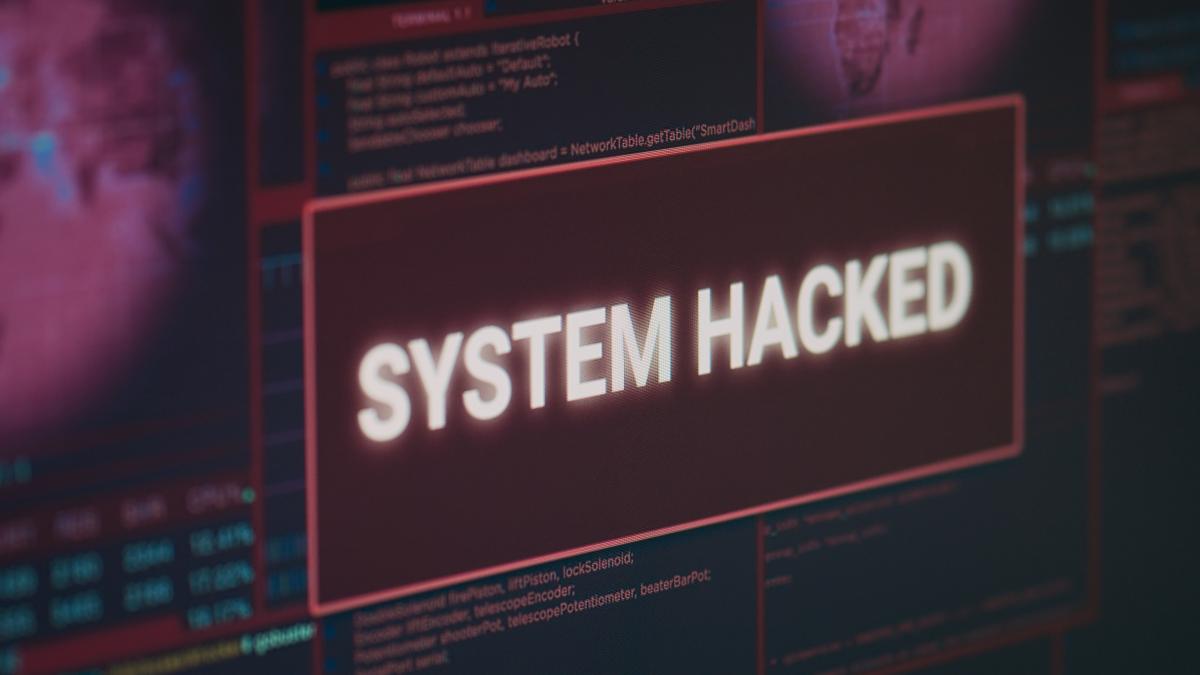 computer-monitor-showing-hacked-system-alert-message-flashing-screen-dealing-with-hacking-cyber-crime-attack-display-with-security-breach-warning-malware-threat-close-up_59937700