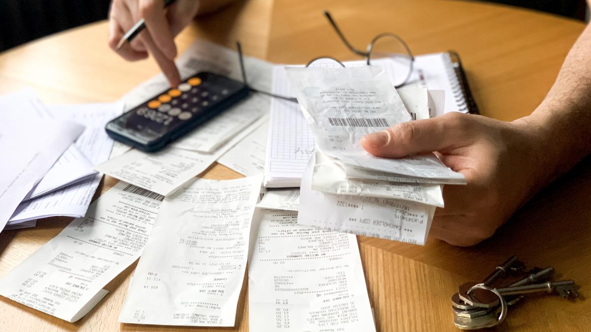 man-is-making-audit-household-expenses-using-calculator-notebook-lots-receipts-bills-1_43740600