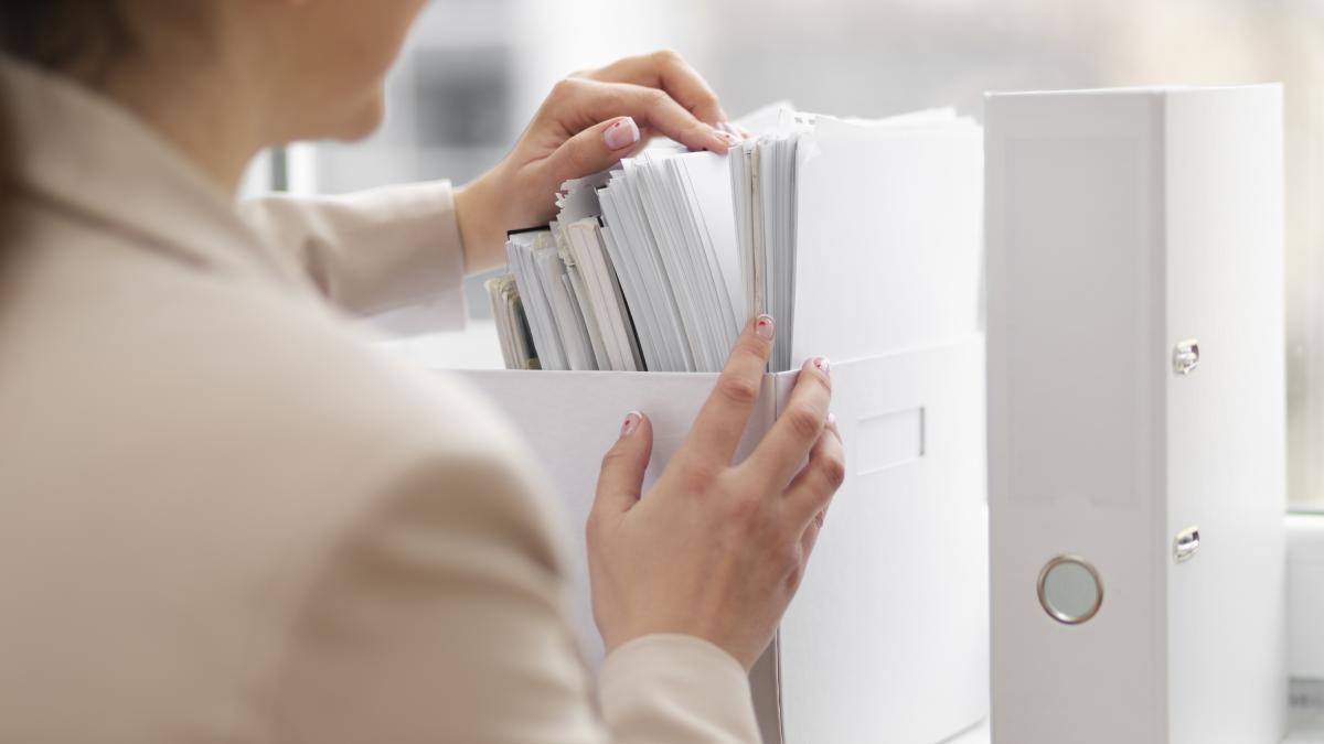 young-adult-organizing-documents-1_10748100