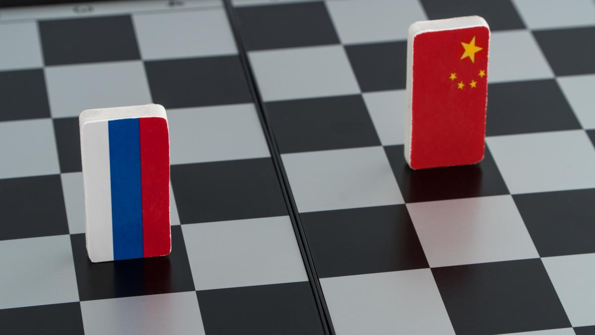 symbols-flag-russia-china-chessboard-concept-political-game_90463400