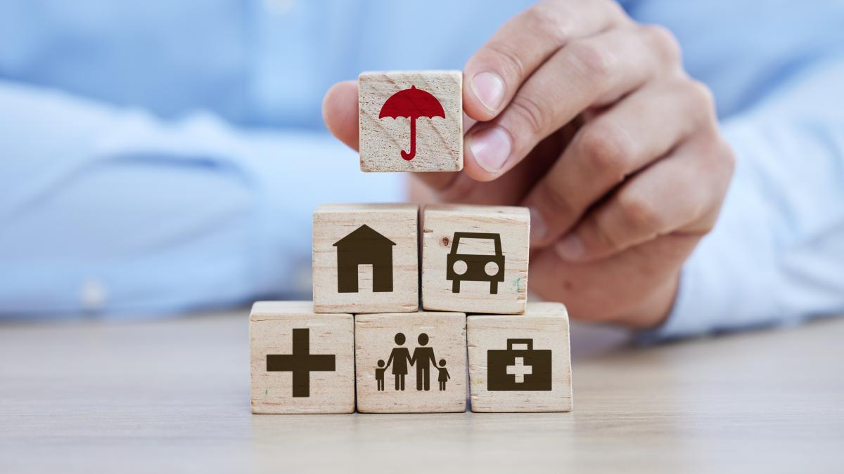 healthcare-life-insurance-building-blocks-with-hands-man-safety-medical-planning-future-investment-retirement-with-wooden-cube-tower-table-savings-property-medicine_91567100