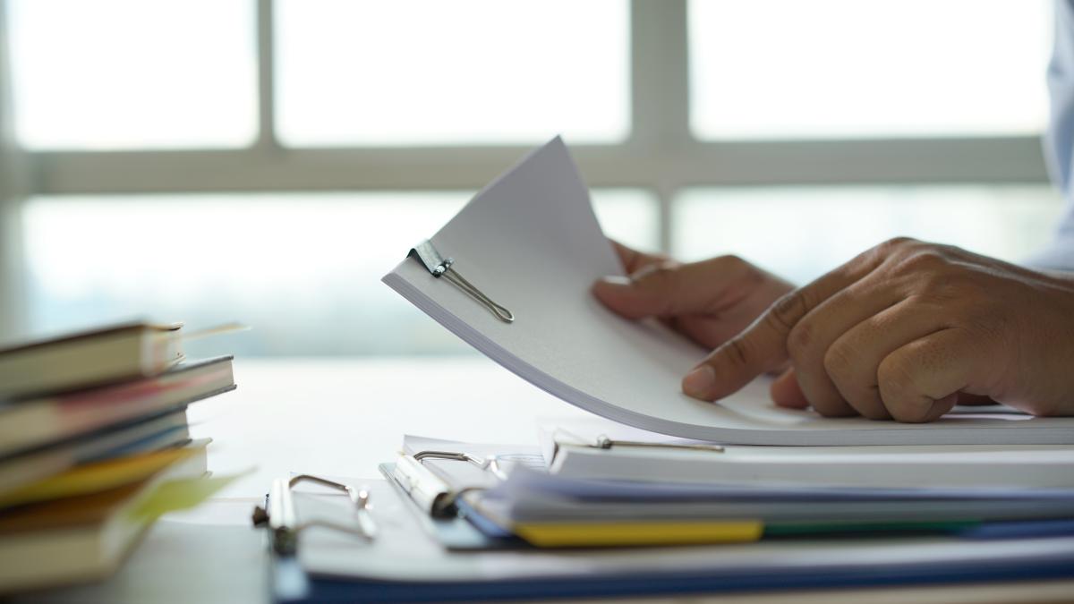 businessman-working-reading-documents-graph-financial-job-succes_19308700