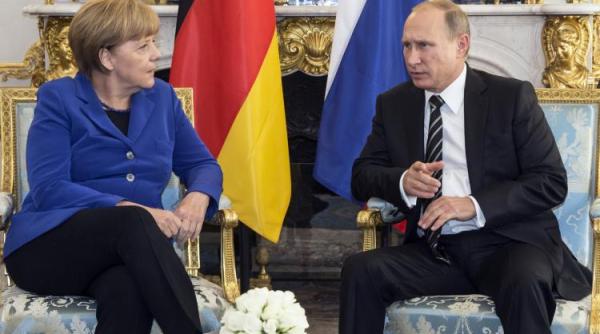 Vladimir Putin şi Angela Merkel la discuții despre Iran, Libia şi Siria 
