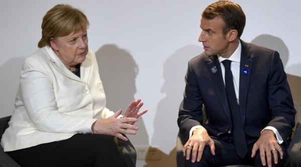Macron și Merkel relaxează restricțiile de la frontiere