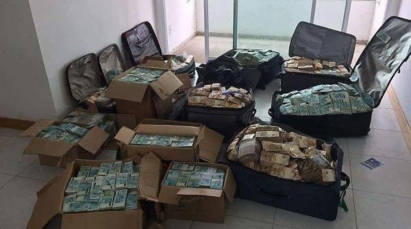 Germania. Valize cu bani, confiscate de la români, implicați într-o rețea de trafic de persoane