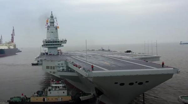 China își flexează mușchii și testează al treilea portavion
